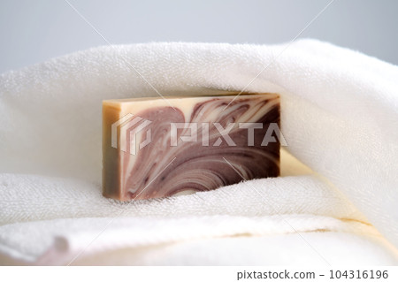 Beauty handmade soap on a terry towel. Beauty handmade soap on a terry towel. 104316196