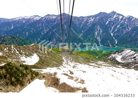 Tateyama Kurobe Alpine Route View of Lake Kurobe through the remaining snow from the Tateyama Ropeway Tateyama Town, Nakaniikawa District, Toyama Prefecture Tateyama Kurobe Alpine Route View of Lake Kurobe through the remaining snow from the Tateyama Ropeway Tateyama Town, Nakaniikawa District, Toyama Prefecture 104316233