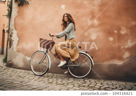 Full-length body size side profile photo of a cheerful girl riding bicycle on vibrant color background 104316821