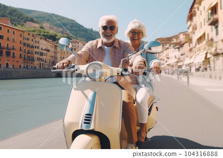 Happy mature couple riding a scooter in the city on a sunny day 104316888