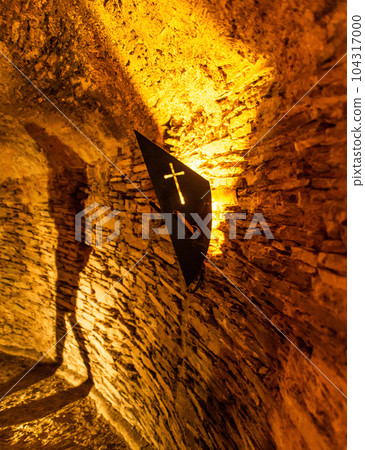 Old light at night hanging on a medieval fortress wall background torch stand or mount Old light at night hanging on a medieval fortress wall background torch stand or mount 104317000