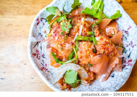 salmon sashimi with spicy sauce in Japanese restaurant, Japanese Food 104317551