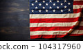 Folded vintage USA flag on wood plank background 104317960