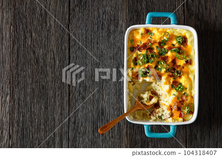 Loaded smashed potatoes with cheese, bacon, cream Loaded smashed potatoes with cheese, bacon, cream 104318407