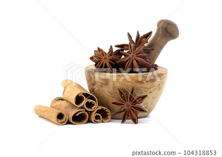 Mortar filled with star anise and cinnamon sticks Mortar filled with star anise and cinnamon sticks 104318853