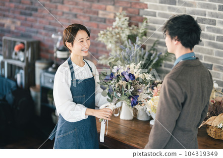 Flower shop female clerk 104319349