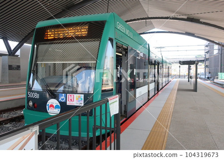 A green mover stopping at Hiroden Miyajimaguchi Station A green mover stopping at Hiroden Miyajimaguchi Station 104319673