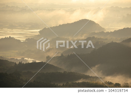 Spring paddy field landscape in mountains with fog Spring paddy field landscape in mountains with fog 104319734