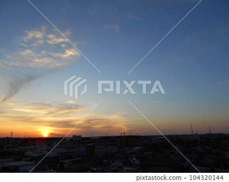 The setting sun and orange clouds 104320144