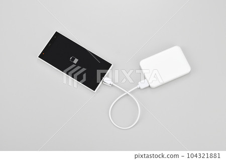 Charging your smartphone with a mobile battery Charging your smartphone with a mobile battery 104321881