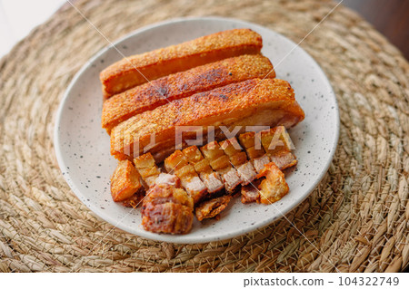 crispy fried pork belly in a plate 104322749