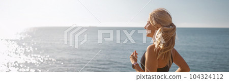 Caucasian female at daily fitness regime outdoors 104324112