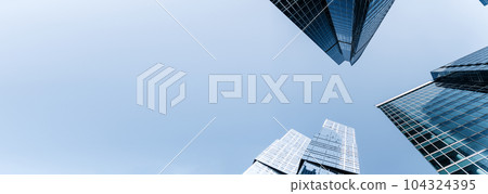 Business skyscrapers and office business center building on banner background. Economy, exchange, finance concept. Business skyscrapers and office business center building on banner background. Economy, exchange, finance concept. 104324395