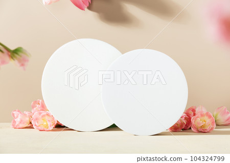 Abstract geometric pedestals and pink tulips on beige background 104324799