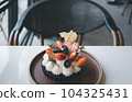 fruit tart served on table 104325431