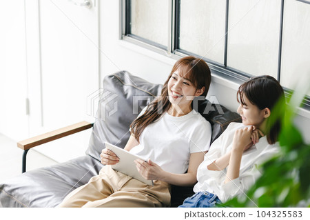 Female friend tablet 104325583