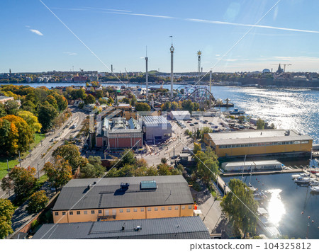 View of amusement park Grona Lund with carousels and tour rides on Djurgarden island Stockholm Sweden 104325812