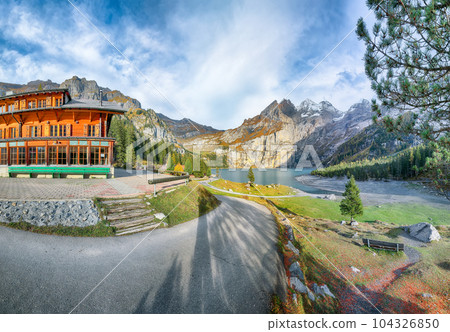 Amazing autumn view of Oeschinensee Lake. Amazing autumn view of Oeschinensee Lake. 104326850