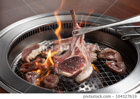 grilling raw lamb 104327619