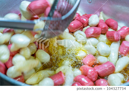 Deep fried meatballs and sausage in the pan, Popular Thai street food. Deep fried meatballs and sausage in the pan, Popular Thai street food. 104327734