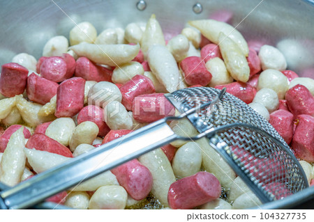 Deep fried meatballs and sausage in the pan, Popular Thai street food. Deep fried meatballs and sausage in the pan, Popular Thai street food. 104327735