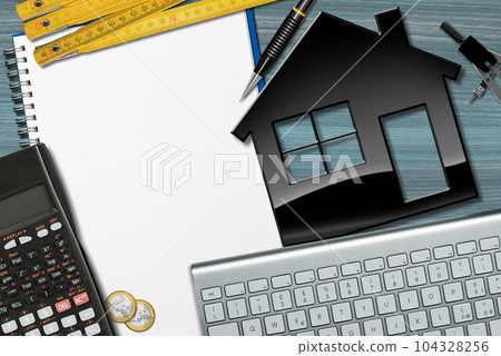 Small Model House on a Desk with Blank Note Book Small Model House on a Desk with Blank Note Book 104328256