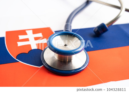 Stethoscope on Slovakia flag background, Business and finance concept. Stethoscope on Slovakia flag background, Business and finance concept. 104328811