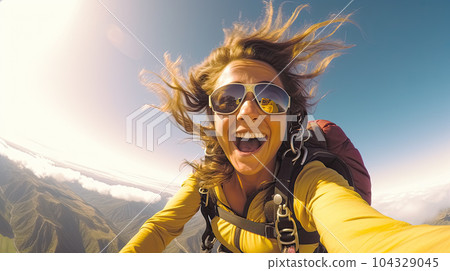 Young woman parachutist smiling in free fall. Perfect concept of happiness and freedom. 104329045