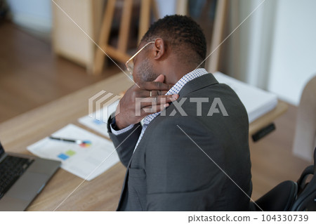 Burnout American African business man in stress works with many paperwork document, migraine attack, Freelance, work from home. Burnout American African business man in stress works with many paperwork document, migraine attack, Freelance, work from home. 104330739