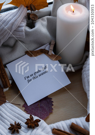 I AM SO GRATE FALL FOR THIS SEASON text greeting card concept Celebrating thanksgiving autumn holidays at cozy home on the windowsill Hygge aesthetic atmosphere Autumn leaves spices and candle on 104330953