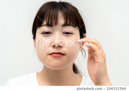 A sad and crying woman 104331564