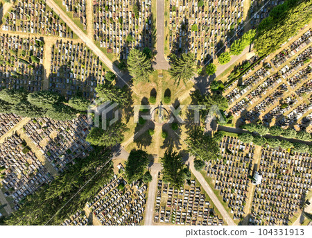 Top view on a Cemetery in Strasbourg. Aerial view at Graves at sunny day. Pattern of tombs and grave trails 104331913