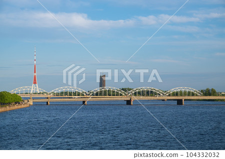 View of the railway bridge over Daugava river and Riga Radio and Television Tower. Riga, Latvia. 104332032