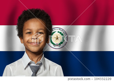 Paraguayan kid boy on flag of Paraguay background. Education and childhood concept Paraguayan kid boy on flag of Paraguay background. Education and childhood concept 104332220