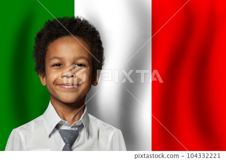 Italian kid boy on flag of Italy background. Education and childhood concept Italian kid boy on flag of Italy background. Education and childhood concept 104332221