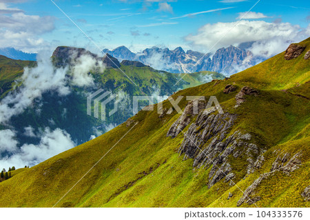 landscape with mountains, hills, clouds and rocks 104333576