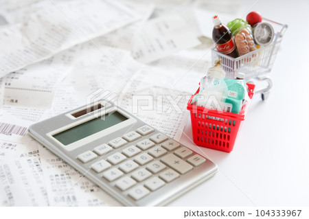Shopping cart with food, shopping basket and calculator, receipt household money image Shopping cart with food, shopping basket and calculator, receipt household money image 104333967