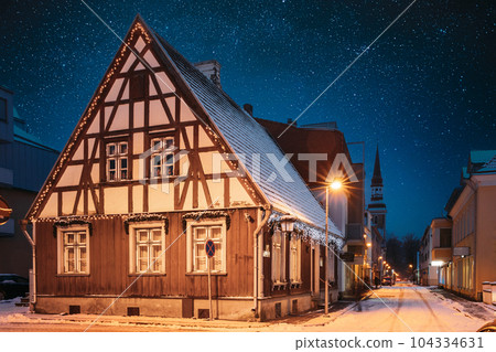 Parnu, Estonia. Night View Of Kuninga Street With Old Buildings, Houses, Restaurants, Cafe, Hotels And Shops In Evening Night Illuminations. Amazing Bold Bright Blue Starry Sky Gradient Parnu, Estonia. Night View Of Kuninga Street With Old Buildings, Houses, Restaurants, Cafe, Hotels And Shops In Evening Night Illuminations. Amazing Bold Bright Blue Starry Sky Gradient 104334631