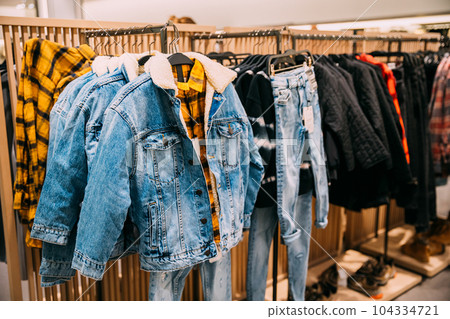 Warm Winter denim Jacket In Store Of Shopping Center. shelf display in shop mall store. Store Of Shopping Center. retail sale Warm Winter denim Jacket In Store Of Shopping Center. shelf display in shop mall store. Store Of Shopping Center. retail sale 104334721