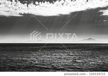 Dramatic Sky Background. Sunset, Sunrise Light And Starry Sky Above Mountains And Sea. Amazing Natural Bright Dramatic Sky During Sunset Sunrise Time. Black Colors Dramatic Sky Background. Sunset, Sunrise Light And Starry Sky Above Mountains And Sea. Amazing Natural Bright Dramatic Sky During Sunset Sunrise Time. Black Colors 104334725