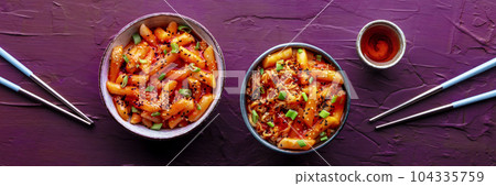 Tteokbokki or topokki and rabokki, Korean street food, spicy rice cakes 104335759