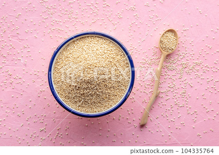 Quinoa in a bowl, healthy organic wood, uncooked Quinoa in a bowl, healthy organic wood, uncooked 104335764