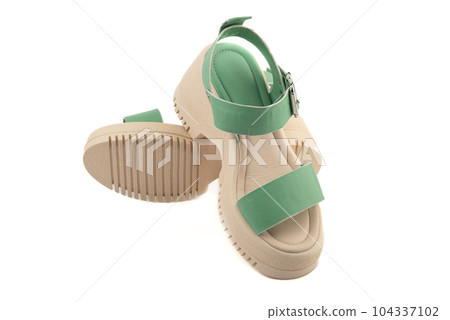 Women's summer sandals with rubber soles and leather uppers on a white background. 104337102
