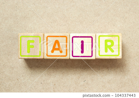 Wooden alphabet letter block in word fair on wood background 104337443