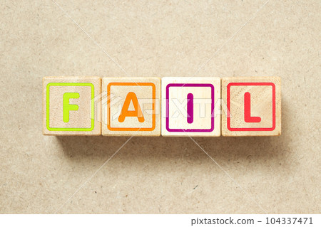 Wooden alphabet letter block in word fail on wood background 104337471