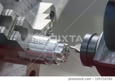 The CNC lathe machine  milling cut the metal shaft parts by milling spindle. 104338760