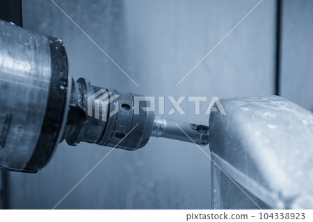 The 5-axis CNC milling machine  cutting the automotive part with indexable tool. 104338923