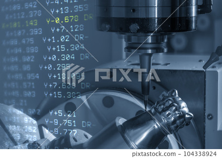 The abstract scene the 5-axis machining center cutting the sample parts and NC data background. 104338924