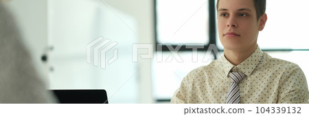 Businessman giving document for signature to partner in office 104339132