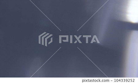 Noise like light on right side of gray background 104339252